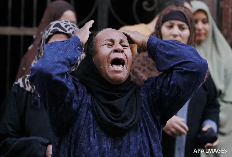 Relatives and families of members of Muslim Brotherhood and supporters of ousted President Mohamed Mursi react after hearing the sentence, in front of the court in Minya, south of Cairo, April 28, 2014. An Egyptian court...