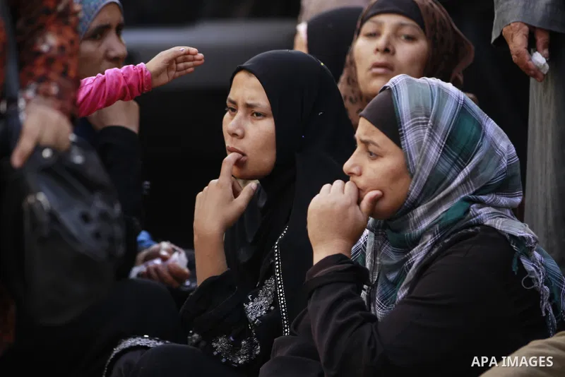 Relatives and families of members of Muslim Brotherhood and supporters of ousted President Mohamed Mursi react after hearing the sentence, in front of the court in Minya, south of Cairo, April 28, 2014. An Egyptian court...