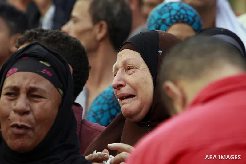 Relatives and families of members of Muslim Brotherhood and supporters of ousted President Mohamed Mursi react after hearing the sentence, in front of the court in Minya, south of Cairo, April 28, 2014. An Egyptian court...