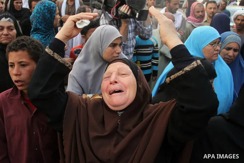 Relatives and families of members of Muslim Brotherhood and supporters of ousted President Mohamed Mursi react after hearing the sentence, in front of the court in Minya, south of Cairo, April 28, 2014. An Egyptian court...