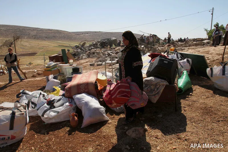 Palestinians inspect the remains of a mosque after it was demolished by Israeli authorities who said it was built without municipal permission on April 29, 2014 in the West Bank village of Khirbet al-Tawil, south of Nabl...