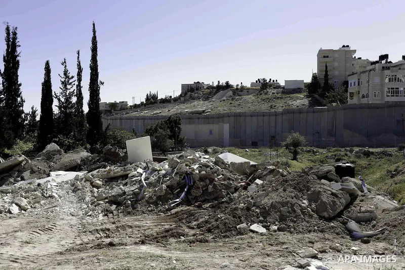 The remains of a Palestinian shed is seen following demolished by Israeli bulldozers, in al-Tur neighborhood, east Jerusalem on April 29, 2014. Israeli forces accompanied by bulldozers, stormed Al-Hardub neighborhood at...