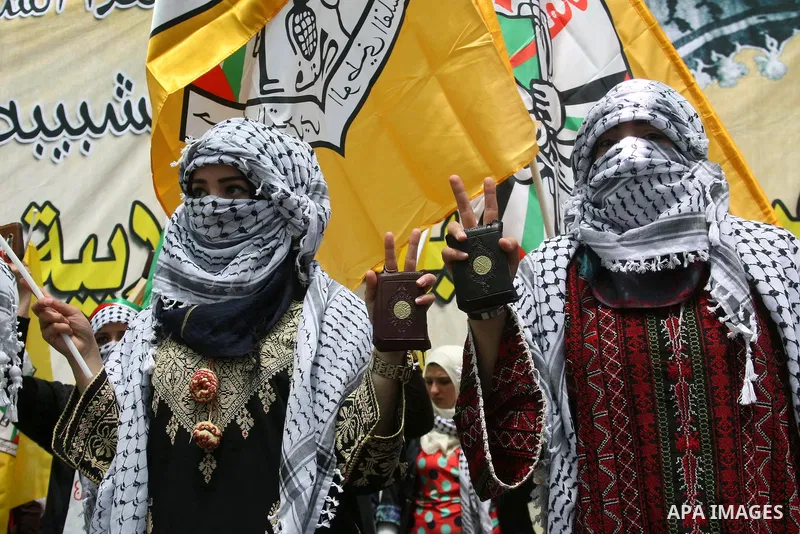 Palestinian students who support the mainstream Fatah organization hold a rally during the party's election campaign at the Palestine Polytechnic University, in the West Bank city of Hebron, 29 April 2014. Hamas spokesma...