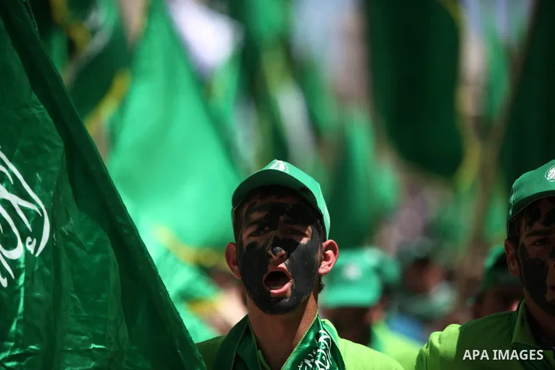 Palestinian students who support the Hamas movement hold a rally during the party's election campaign at the Palestine Polytechnic University, in the West Bank city of Hebron, 29 April 2014. Hamas spokesman Sami Abu Zuhr...