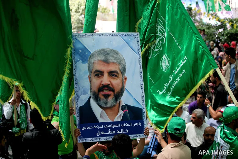 Palestinian students who support the Hamas movement hold a rally during the party's election campaign at the Palestine Polytechnic University, in the West Bank city of Hebron, 29 April 2014. Hamas spokesman Sami Abu Zuhr...