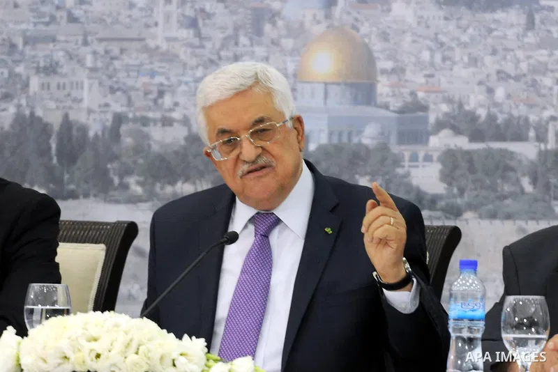 Palestinian President Mahmoud Abbas attends a meeting of Palestinian businessmen from East Jerusalem to set up a national fund to support the Palestinian residents of East Jerusalem, at his office in the West Bank town o...