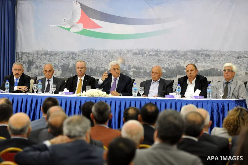 Palestinian President Mahmoud Abbas attends a meeting of Palestinian businessmen from East Jerusalem to set up a national fund to support the Palestinian residents of East Jerusalem, at his office in the West Bank town o...