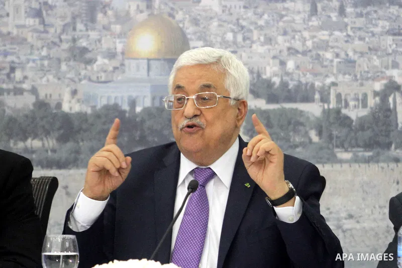 Palestinian President Mahmoud Abbas attends a meeting of Palestinian businessmen from East Jerusalem to set up a national fund to support the Palestinian residents of East Jerusalem, at his office in the West Bank town o...