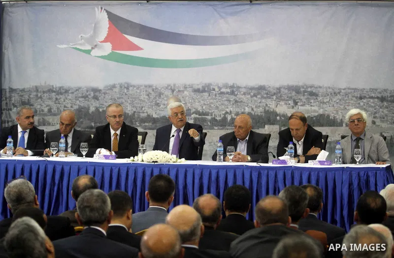 Palestinian President Mahmoud Abbas attends a meeting of Palestinian businessmen from East Jerusalem to set up a national fund to support the Palestinian residents of East Jerusalem, at his office in the West Bank town o...