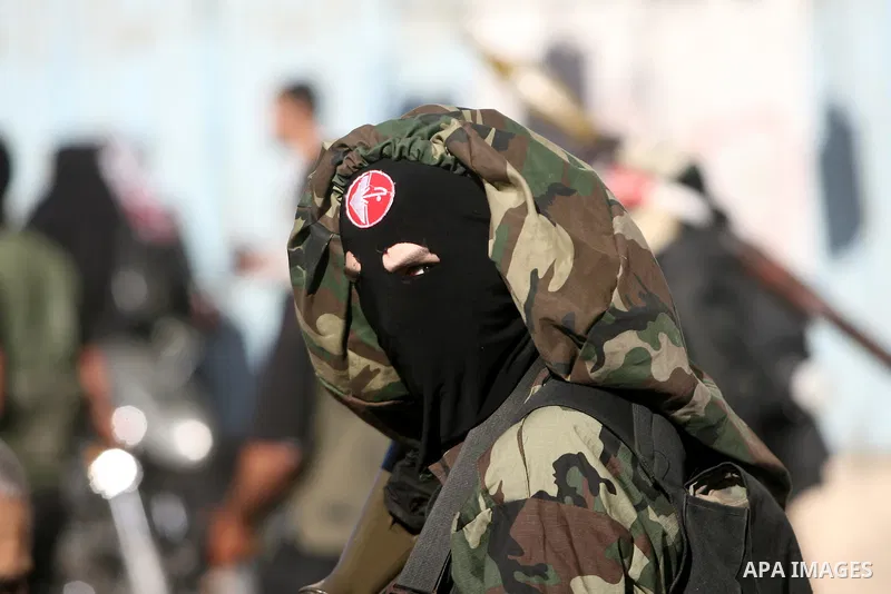 Palestinian militants from Popular Front for the Liberation of Palestine (PFLP) march during an anti-Israel parade in Khan Younis in the southern Gaza Strip, April 29, 2014. Photo by Eyad Al Baba