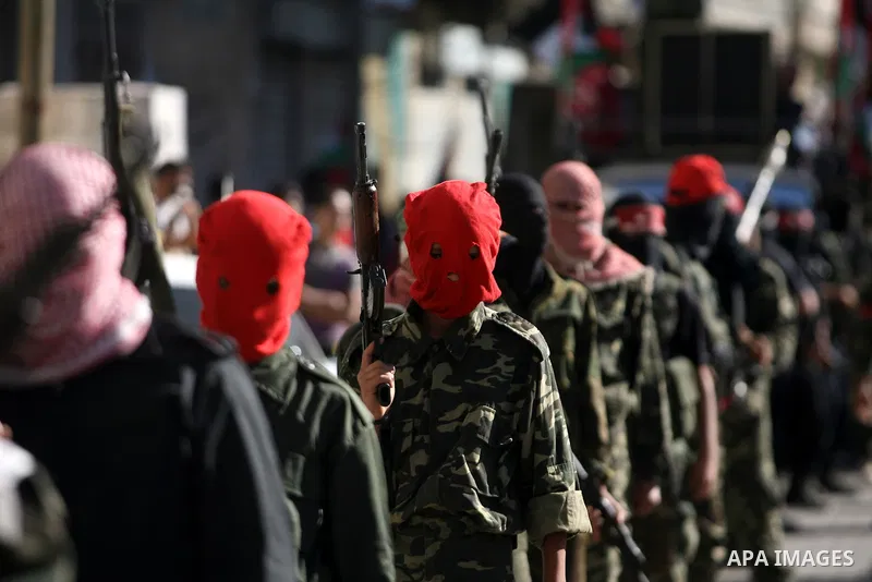Palestinian militants from Popular Front for the Liberation of Palestine (PFLP) march during an anti-Israel parade in Khan Younis in the southern Gaza Strip, April 29, 2014. Photo by Eyad Al Baba