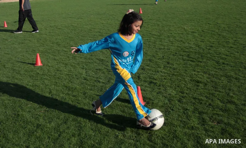Palestinian girls take part in a training session at the Beit Lahia football club in the northern Gaza strip, on April 30, 2014 as part of an after-school sport program funded by the Palestine Association for Children s...