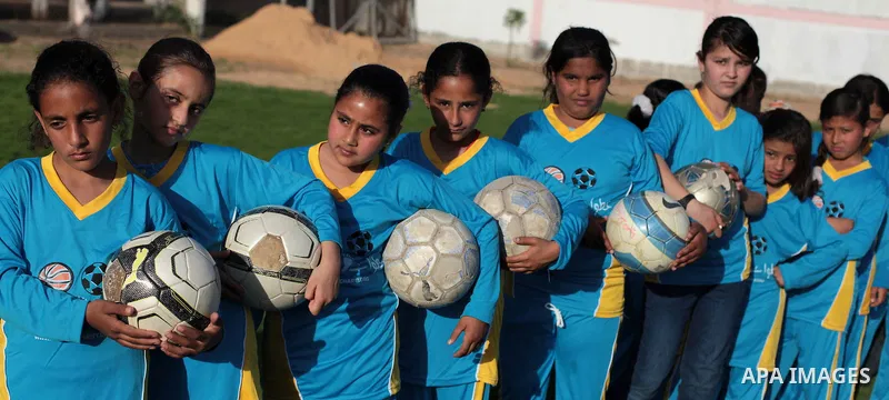 Palestinian girls take part in a training session at the Beit Lahia football club in the northern Gaza strip, on April 30, 2014 as part of an after-school sport program funded by the Palestine Association for Children s...
