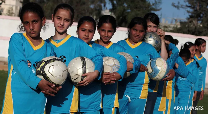 Palestinian girls take part in a training session at the Beit Lahia football club in the northern Gaza strip, on April 30, 2014 as part of an after-school sport program funded by the Palestine Association for Children s...