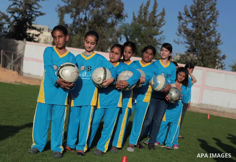 Palestinian girls take part in a training session at the Beit Lahia football club in the northern Gaza strip, on April 30, 2014 as part of an after-school sport program funded by the Palestine Association for Children s...