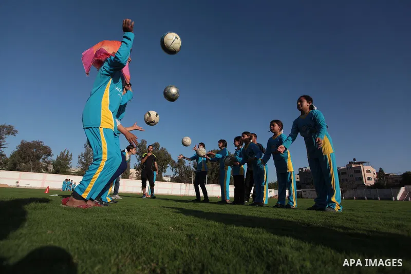 Palestinian girls take part in a training session at the Beit Lahia football club in the northern Gaza strip, on April 30, 2014 as part of an after-school sport program funded by the Palestine Association for Children s...