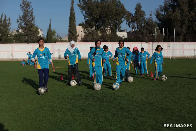 Palestinian girls take part in a training session at the Beit Lahia football club in the northern Gaza strip, on April 30, 2014 as part of an after-school sport program funded by the Palestine Association for Children s...