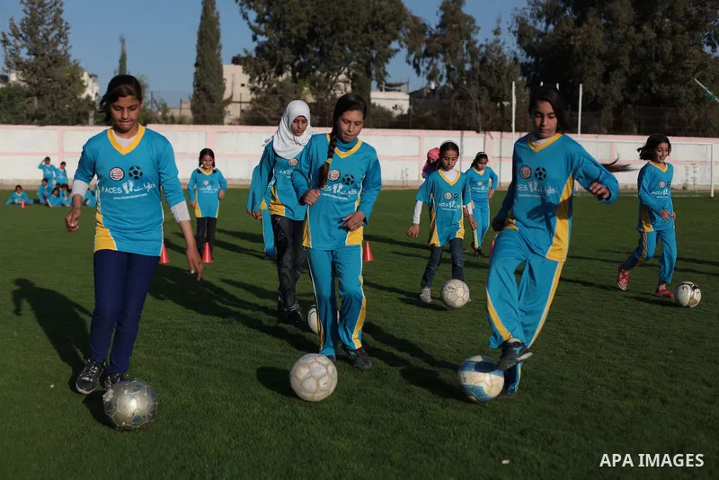 Palestinian girls take part in a training session at the Beit Lahia football club in the northern Gaza strip, on April 30, 2014 as part of an after-school sport program funded by the Palestine Association for Children s...