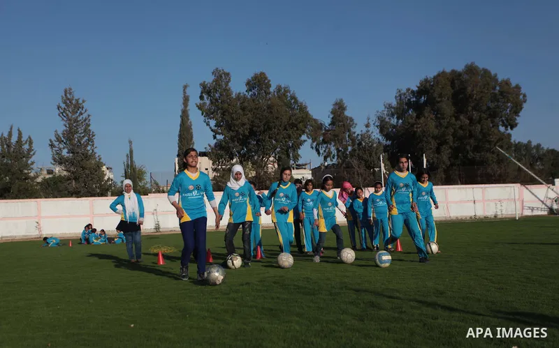Palestinian girls take part in a training session at the Beit Lahia football club in the northern Gaza strip, on April 30, 2014 as part of an after-school sport program funded by the Palestine Association for Children s...