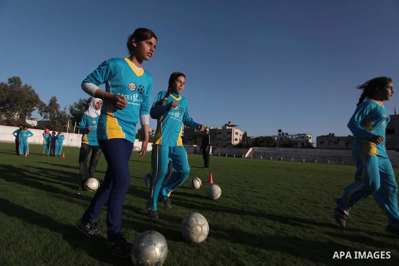 Palestinian girls take part in a training session at the Beit Lahia football club in the northern Gaza strip, on April 30, 2014 as part of an after-school sport program funded by the Palestine Association for Children s...