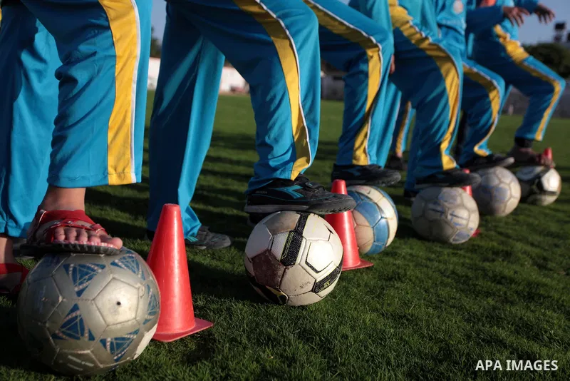 Palestinian girls take part in a training session at the Beit Lahia football club in the northern Gaza strip, on April 30, 2014 as part of an after-school sport program funded by the Palestine Association for Children s...