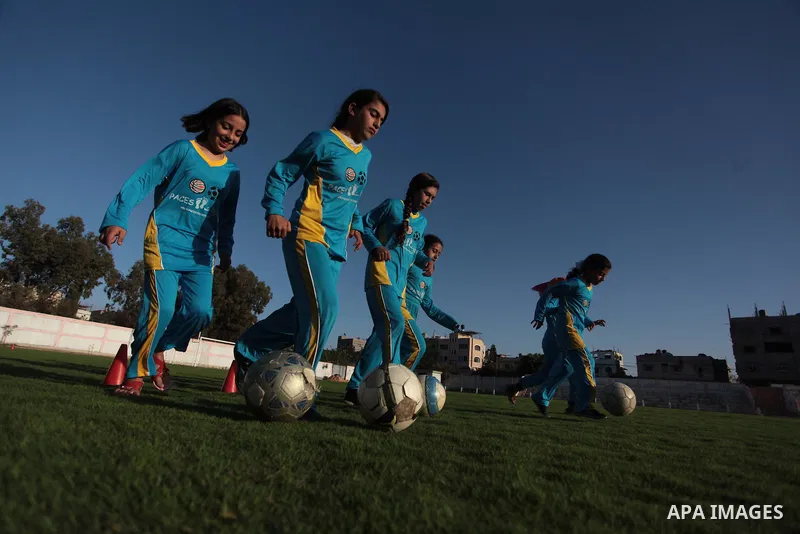 Palestinian girls take part in a training session at the Beit Lahia football club in the northern Gaza strip, on April 30, 2014 as part of an after-school sport program funded by the Palestine Association for Children s...