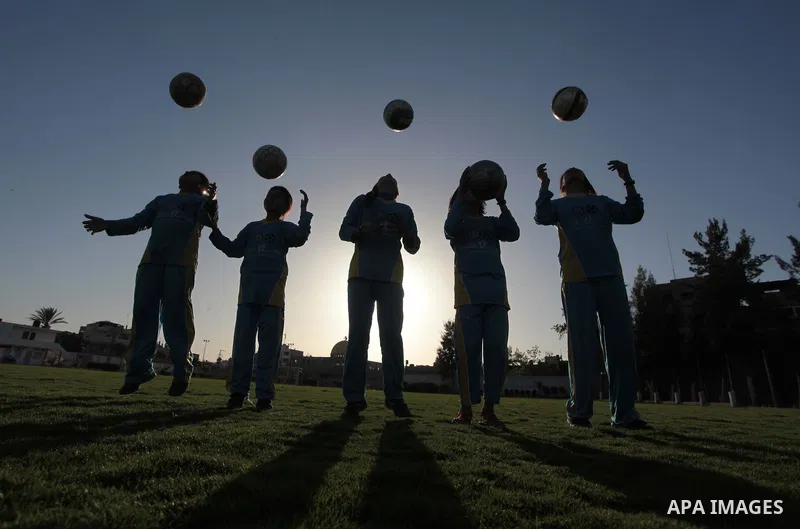 Palestinian girls take part in a training session at the Beit Lahia football club in the northern Gaza strip, on April 30, 2014 as part of an after-school sport program funded by the Palestine Association for Children s...