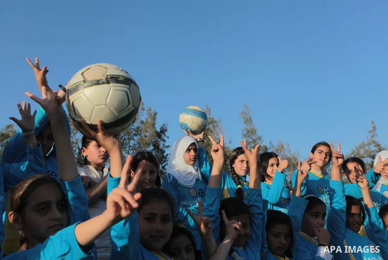 Palestinian girls take part in a training session at the Beit Lahia football club in the northern Gaza strip, on April 30, 2014 as part of an after-school sport program funded by the Palestine Association for Children s...