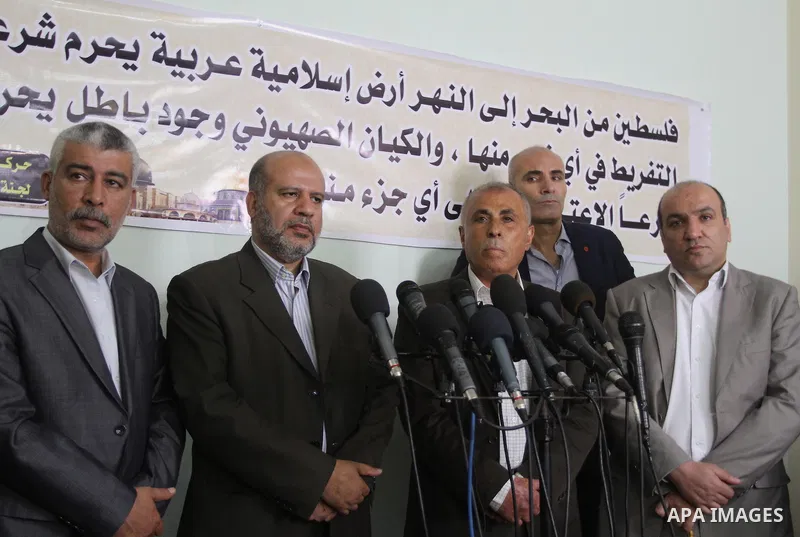 Members of the Freedoms Committee, which includes Fatah, Hamas and others Palestinian movements, meet to follow up the implementation of the reconciliation steps, in Gaza City, on April 30, 2014. Israeli cabinet minister...