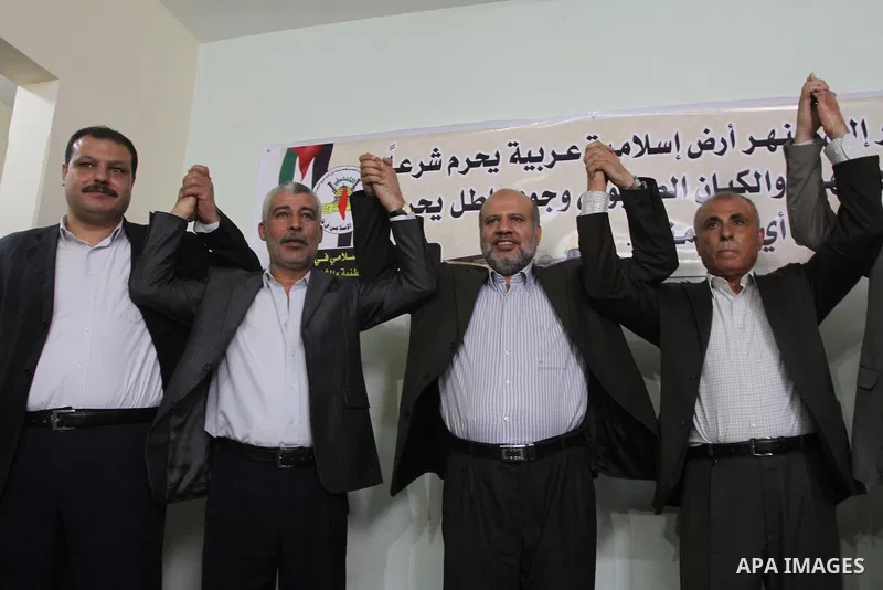 Members of the Freedoms Committee, which includes Fatah, Hamas and others Palestinian movements, meet to follow up the implementation of the reconciliation steps, in Gaza City, on April 30, 2014. Israeli cabinet minister...