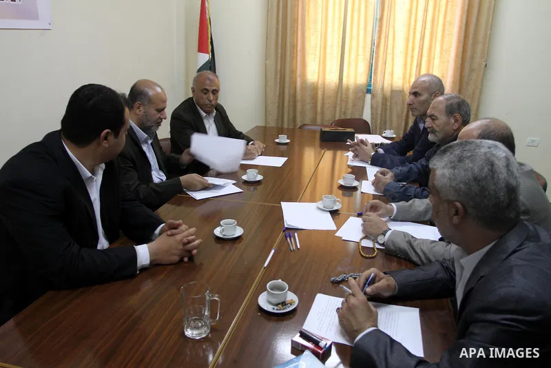 Members of the Freedoms Committee, which includes Fatah, Hamas and others Palestinian movements, meet to follow up the implementation of the reconciliation steps, in Gaza City, on April 30, 2014. Israeli cabinet minister...