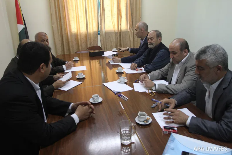 Members of the Freedoms Committee, which includes Fatah, Hamas and others Palestinian movements, meet to follow up the implementation of the reconciliation steps, in Gaza City, on April 30, 2014. Israeli cabinet minister...