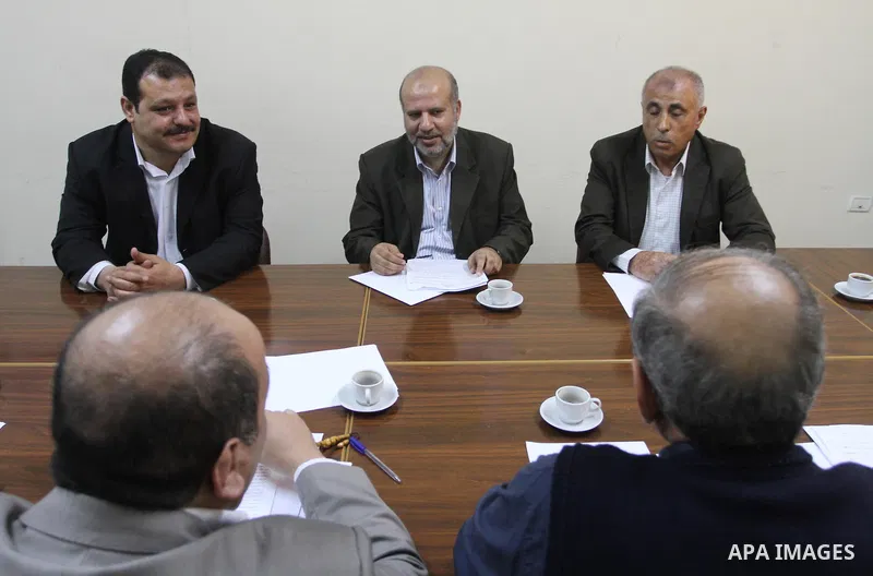 Members of the Freedoms Committee, which includes Fatah, Hamas and others Palestinian movements, meet to follow up the implementation of the reconciliation steps, in Gaza City, on April 30, 2014. Israeli cabinet minister...