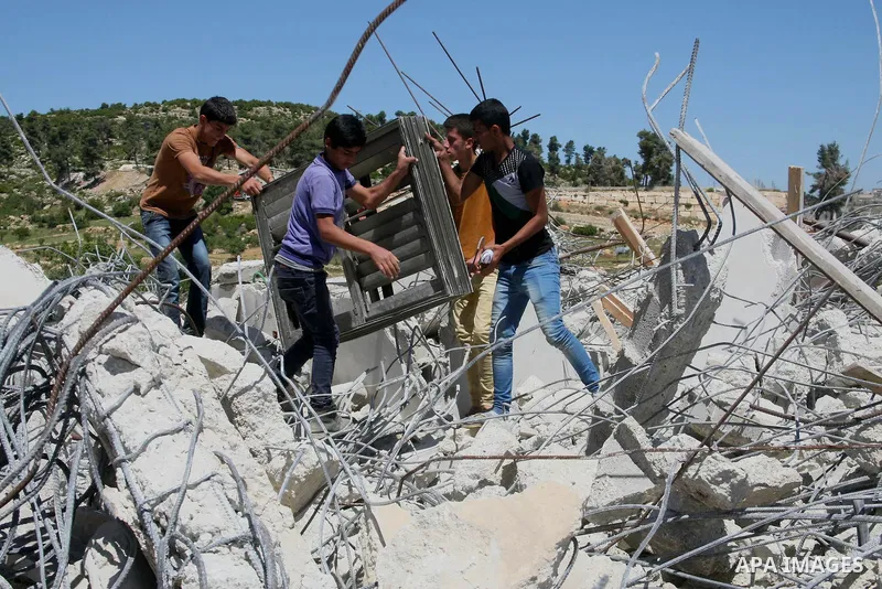 Palestinians inspect the rubble of a house under construction after it was demolished by Israeli bulldozers in Al-Aroub refugee camp, near the West Bank City of Hebron April 30, 2014. Israeli military said that "security...