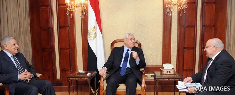 A handout picture made available by the Egyptian presidency shows Egypt's interim president Adly Mansour attends a ceremony marking the International Workers' Day, in Cairo on April 30, 2014. apaimages\Egyptian presidenc...