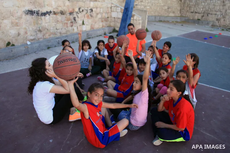Palestinian girls attend a basketball training in Jerusalem's Old City, April 30, 2014. The team is the first women's team belonging to the sons of Jerusalem club, and consists of about 70 girl between the ages of 10 to...