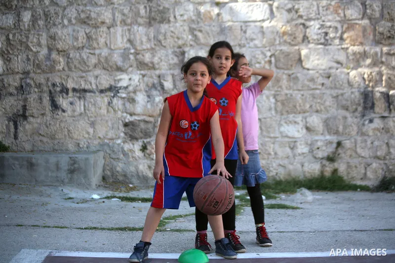 Palestinian girls attend a basketball training in Jerusalem's Old City, April 30, 2014. The team is the first women's team belonging to the sons of Jerusalem club, and consists of about 70 girl between the ages of 10 to...