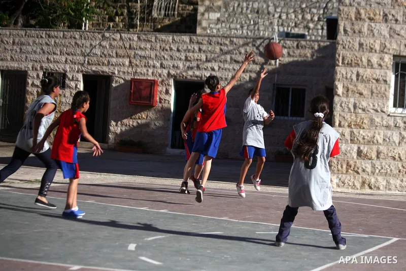 Palestinian girls attend a basketball training in Jerusalem's Old City, April 30, 2014. The team is the first women's team belonging to the sons of Jerusalem club, and consists of about 70 girl between the ages of 10 to...