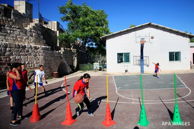 Palestinian girls attend a basketball training in Jerusalem's Old City, April 30, 2014. The team is the first women's team belonging to the sons of Jerusalem club, and consists of about 70 girl between the ages of 10 to...