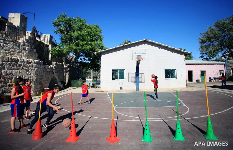 Palestinian girls attend a basketball training in Jerusalem's Old City, April 30, 2014. The team is the first women's team belonging to the sons of Jerusalem club, and consists of about 70 girl between the ages of 10 to...
