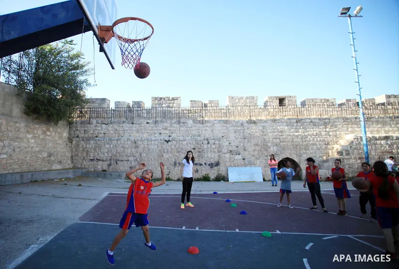 Palestinian girls attend a basketball training in Jerusalem's Old City, April 30, 2014. The team is the first women's team belonging to the sons of Jerusalem club, and consists of about 70 girl between the ages of 10 to...
