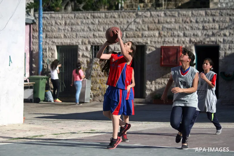 Palestinian girls attend a basketball training in Jerusalem's Old City, April 30, 2014. The team is the first women's team belonging to the sons of Jerusalem club, and consists of about 70 girl between the ages of 10 to...