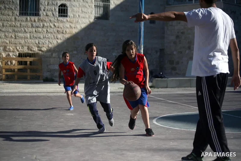 Palestinian girls attend a basketball training in Jerusalem's Old City, April 30, 2014. The team is the first women's team belonging to the sons of Jerusalem club, and consists of about 70 girl between the ages of 10 to...