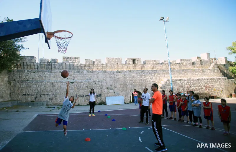 Palestinian girls attend a basketball training in Jerusalem's Old City, April 30, 2014. The team is the first women's team belonging to the sons of Jerusalem club, and consists of about 70 girl between the ages of 10 to...
