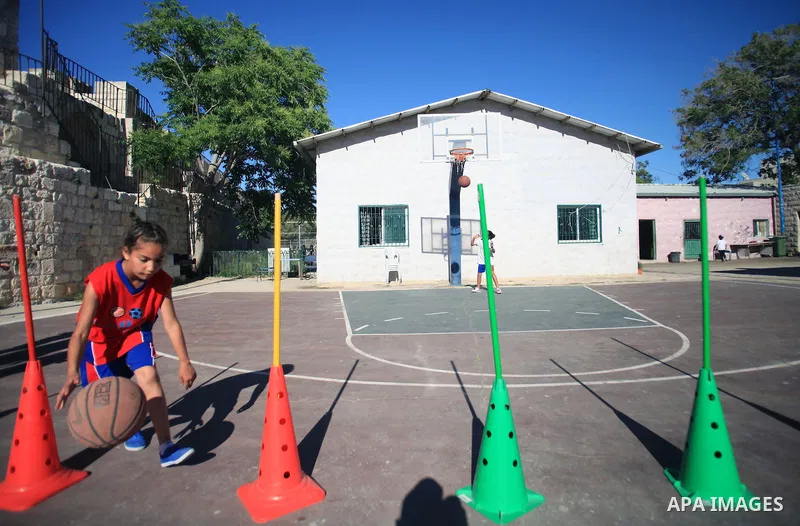 Palestinian girls attend a basketball training in Jerusalem's Old City, April 30, 2014. The team is the first women's team belonging to the sons of Jerusalem club, and consists of about 70 girl between the ages of 10 to...
