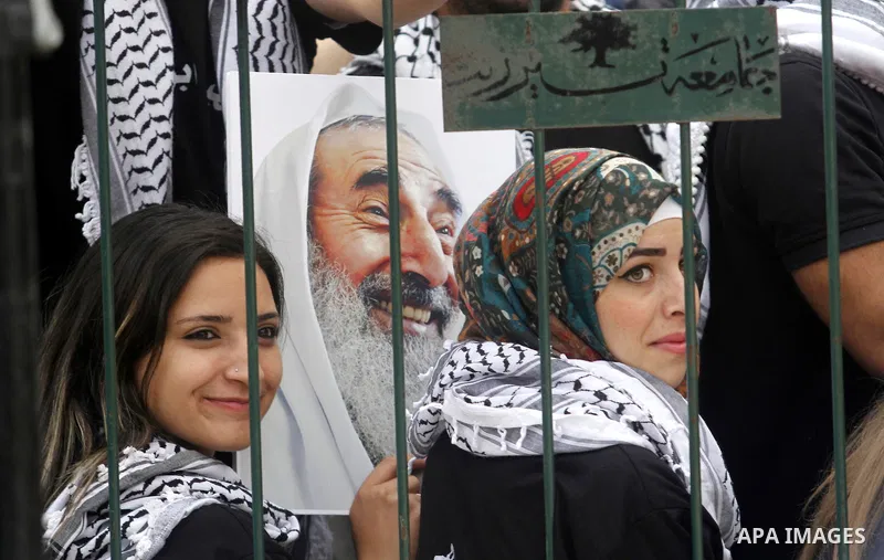 Palestinian supporters of the Fatah movement attend a rally prior to the Student Council elections at Birzeit University, on the outskirts of the city of Ramallah in the West Bank on May 6, 2014. The Student Council elec...