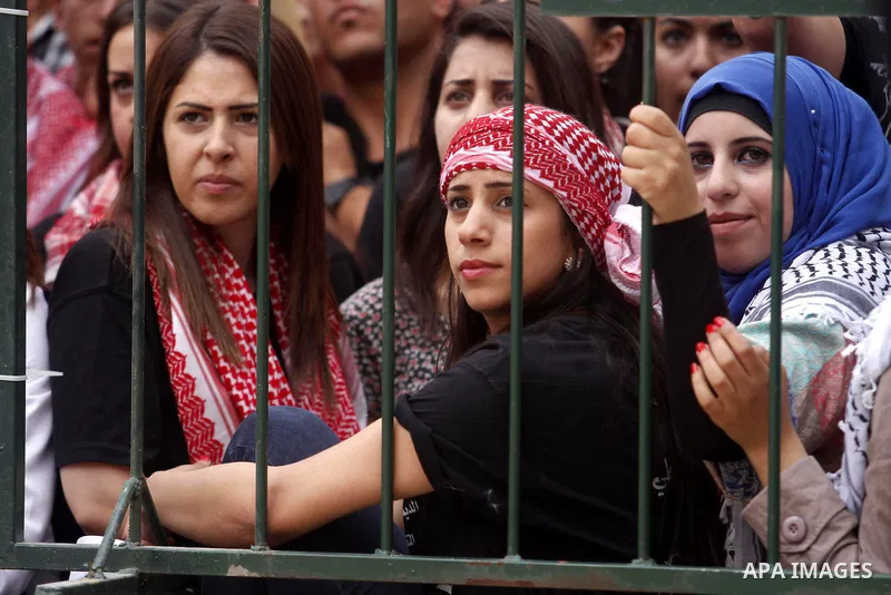 Palestinian supporters of the Popular Front for the Liberation of Palestine (PFLP) attend a rally prior to the Student Council elections at Birzeit University, on the outskirts of the city of Ramallah in the West Bank on...
