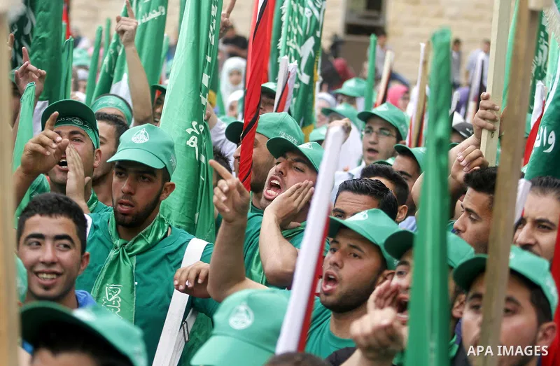 Palestinian supporters of the Islamic Hamas movement attend a rally prior to the Student Council elections at Birzeit University, on the outskirts of the city of Ramallah in the West Bank on May 6, 2014. The Student Coun...