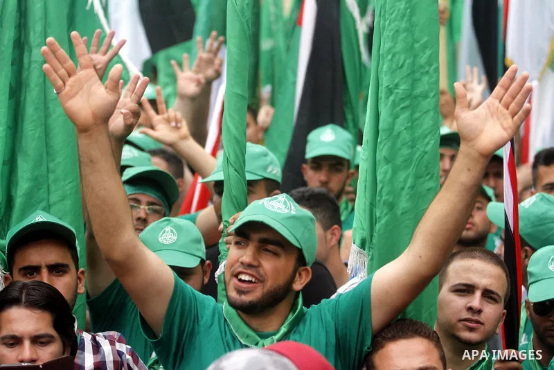 Palestinian supporters of the Islamic Hamas movement attend a rally prior to the Student Council elections at Birzeit University, on the outskirts of the city of Ramallah in the West Bank on May 6, 2014. The Student Coun...