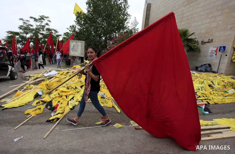 Palestinian supporters of the Popular Front for the Liberation of Palestine (PFLP) attend a rally prior to the Student Council elections at Birzeit University, on the outskirts of the city of Ramallah in the West Bank on...